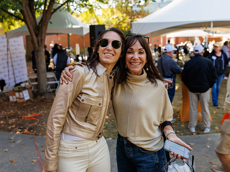 Alumnae wearing gold at the Homecoming Tailgate